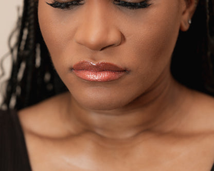 Close-up of a woman's face with a neutral background