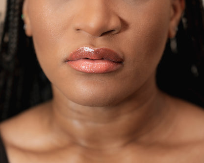Close-up of a woman's face with a focus on her lips.